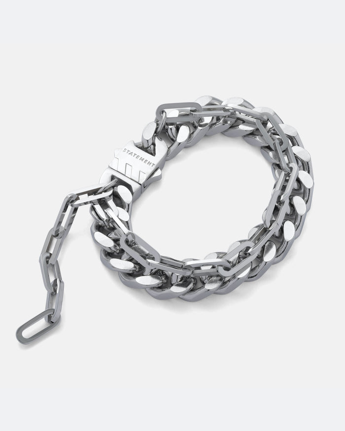 13mm Thick cuban link bracelet with thin paperclip chain attached. Doubele chain bracelet in silver on grey background.