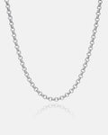 A close-up of the 5mm Rolo Chain, a non-tarnish stainless steel necklace with round links, displayed on a plain white background. The necklace curves gently, with a subtle reflection visible below.