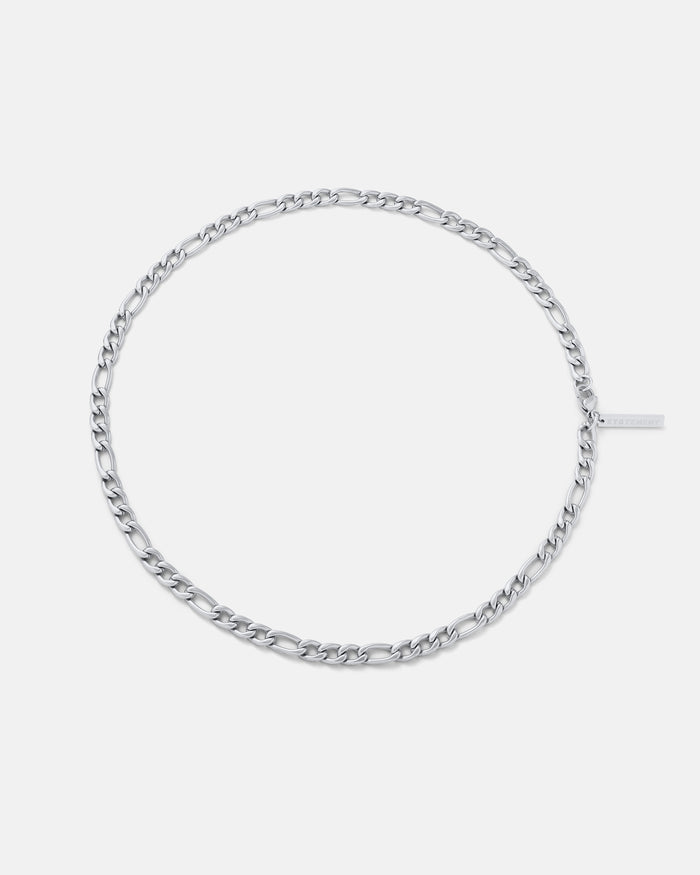 Silver chain bracelet on a light gray background