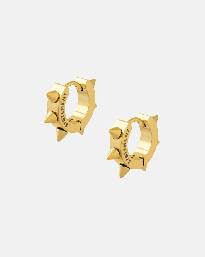 The 8mm Spiked Hoop Earrings (Gold) feature small gold hoops with evenly spaced spikes and "STATEMENT" engraved inside. Perfect for punk fashion lovers. Displayed on a plain white background.