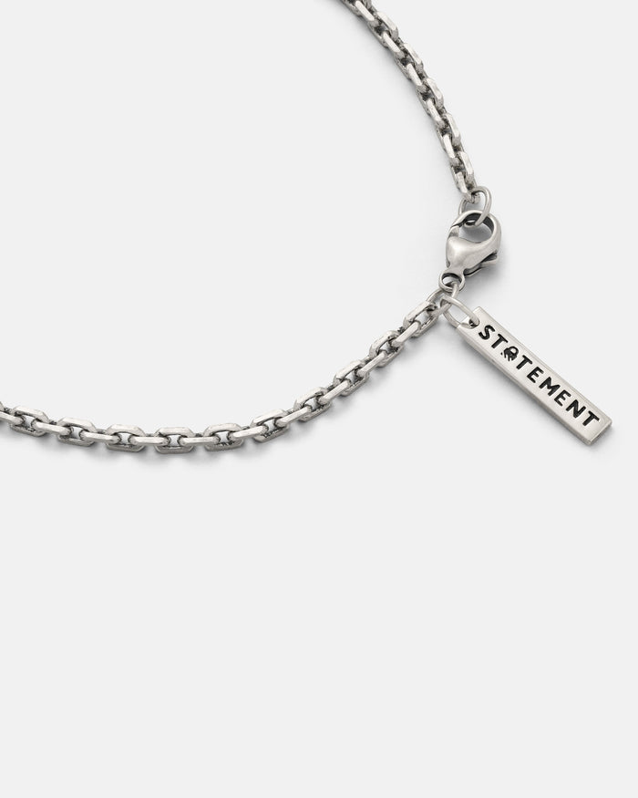 3mm cable chain with a 'STATEMENT' tag on a white background
