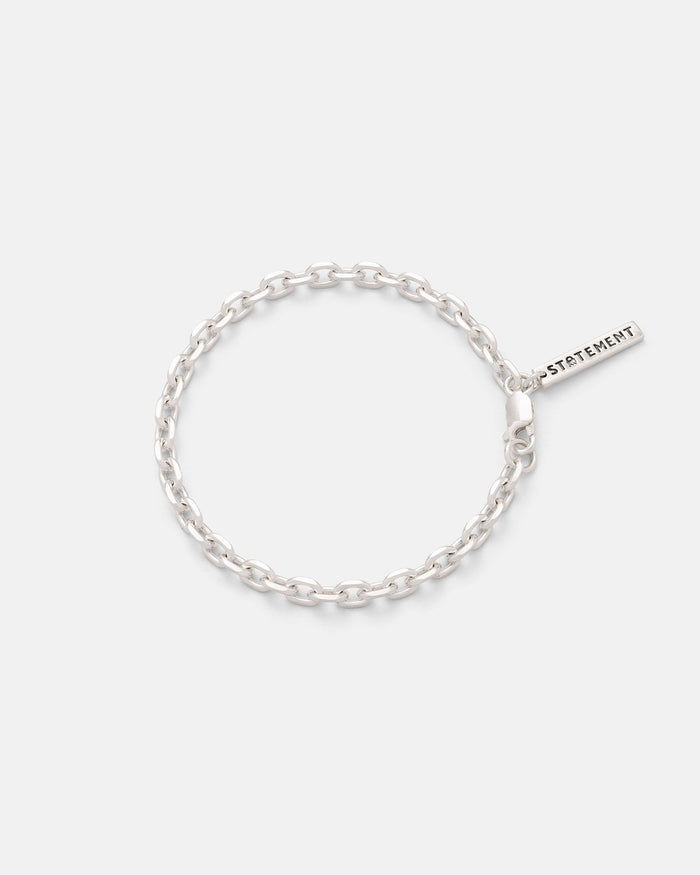 The Statement Collective 925 Sterling Silver 4.5mm Cable Chain Bracelet features oval links and a rectangular STATEMENT tag near the clasp, shown against a plain white background.