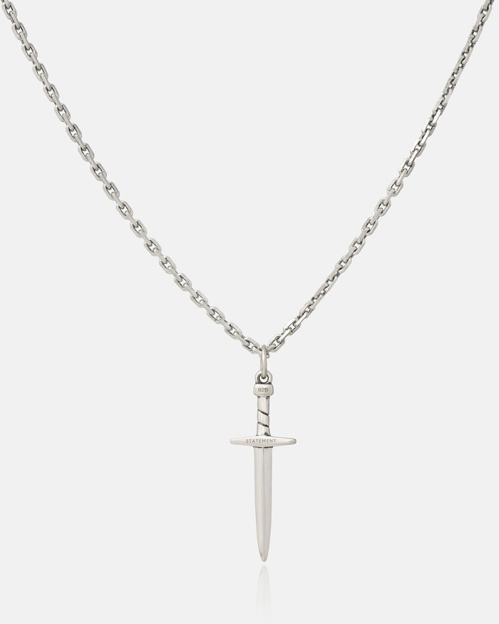 The 925 Sterling Silver Dagger Pendant is a handmade chain necklace featuring a detailed dagger charm engraved with “RADIATE” on the crossguard, displayed on a plain white background—an elegant sterling silver accessory.