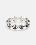 The Statement Collective 925 Sterling Silver “Fleur De Lis” Ring features a repeating fleur-de-lis pattern encircling the band, with engraved STERLING and 925 markings on the inner side. This elegant ring embodies timeless design and classic craftsmanship.