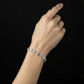 Silver bracelet with crystals on a black background, featuring the brand 'Saheili'.