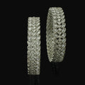 Two silver bracelet with gemstones on a dark background