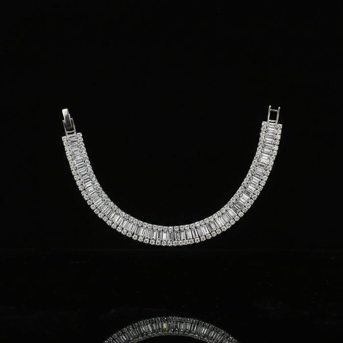 Silver necklace with clear stones on a dark background
