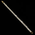 Gold bracelet on a dark gray background
