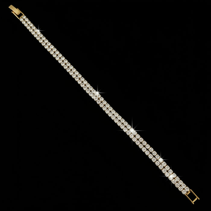 Gold bracelet on a dark gray background
