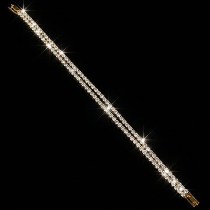 Gold bracelet on a dark gray background