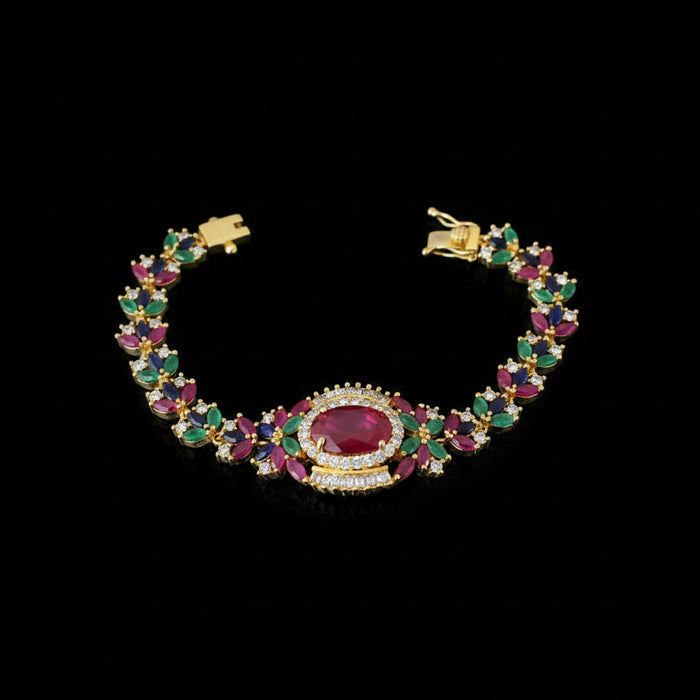 Colorful gemstone bracelet with gold accents on a dark background, featuring the brand 'Saheli'.