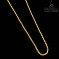 Gold chain necklace on a gray background with 'SAHELI' branding.