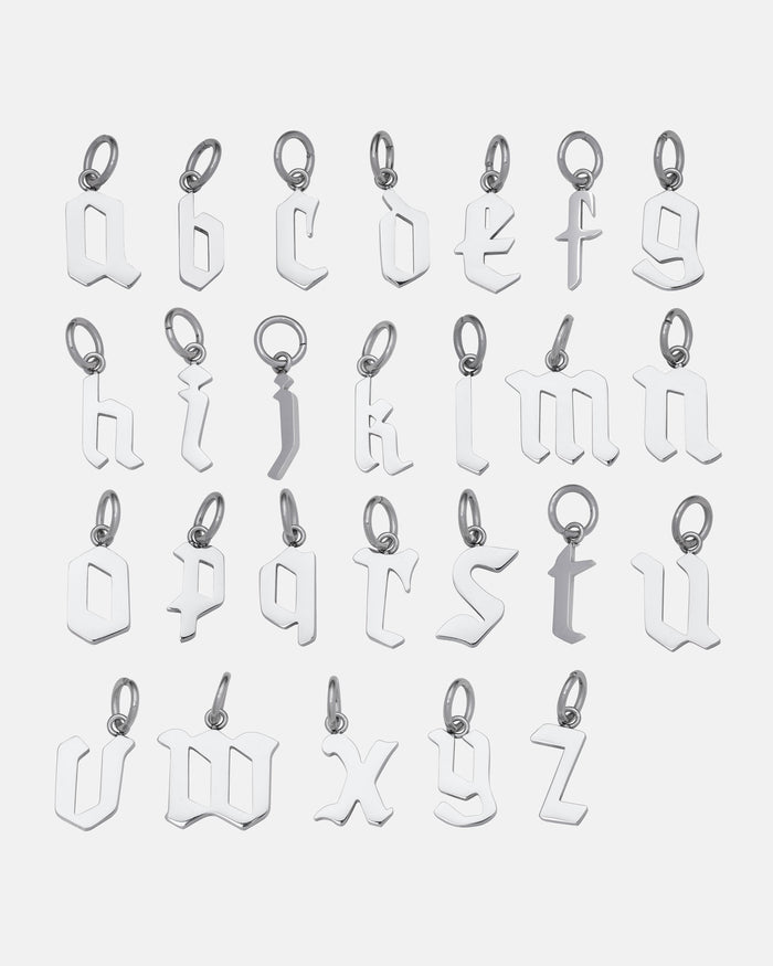Twenty-six Custom Initial Letter Pendant necklaces, each featuring a gothic-style lowercase letter from a to z, are arranged in four rows and displayed on a plain white background.