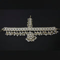 Decorative necklace with pearls on a dark background, branded 'Saheli'.