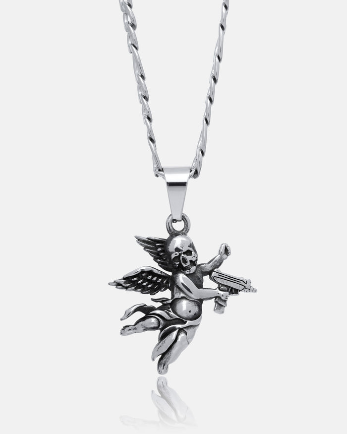 The Death's Cupid Pendant is a bold silver angel cherub necklace with a skull face, detailed wings, gun in hand, and hangs from a twisted chain—striking redemption jewelry set against a white background.