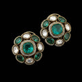 Pair of ornate earrings with green gemstones and 'SJNX-CODE-R-135' text on a light gray background.