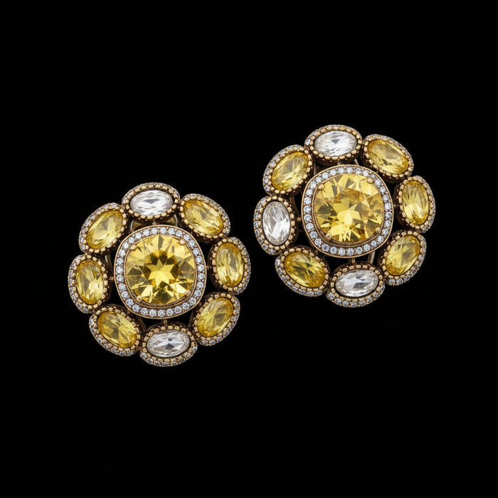 Pair of ornate earrings with green gemstones and 'SJNX-CODE-R-135' text on a light gray background.