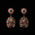 Pair of ornate earrings with gemstones on a black background