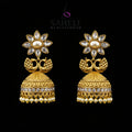 Gold earrings with floral design on a gray stand, branded 'Sahello'.