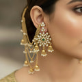 Gold jewelry set with floral designs on a dark background, featuring the brand 'Saheli'.