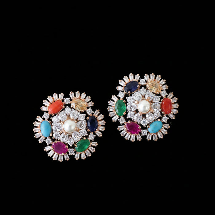 Pair of colorful gemstone earrings on a dark background