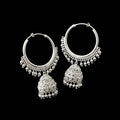 Silver hoop earrings with dangling elements on a black background, featuring the brand 'Sahell'.