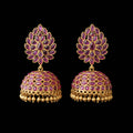 Gold and pink gemstone earrings on a gray stand