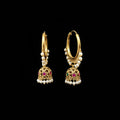 Gold hoop earrings with pearl and gemstone details on a gray stand, branded 'SAHELI'.