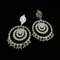 Pair of silver earrings on a black background