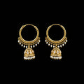 Gold earrings with pearl drops on a gray stand, branded 'Saheli'.