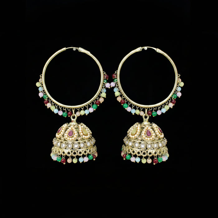 Decorative earrings with colorful beads on a dark background