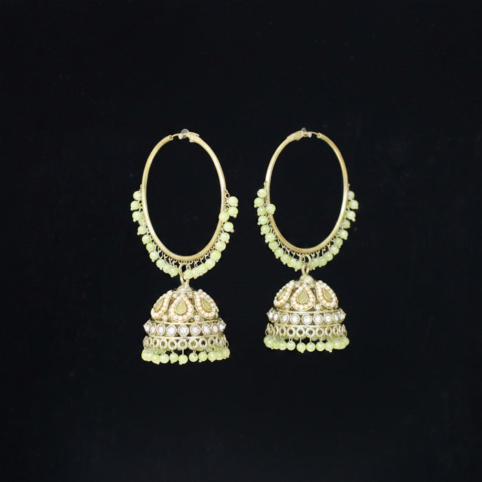 Gold hoop earrings with dangling elements on a black background