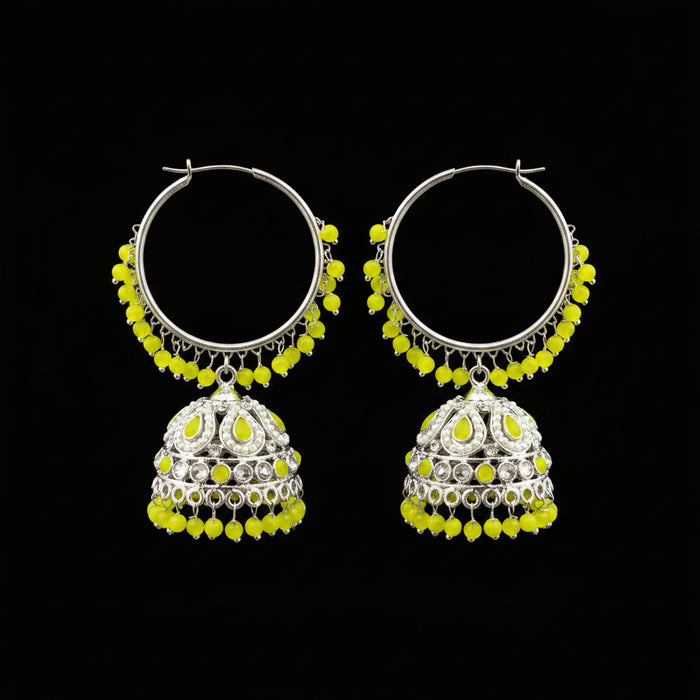 Decorative earrings with yellow beads on a black stand with HP logo in the background