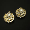 Pair of gold and diamond earrings on a black background