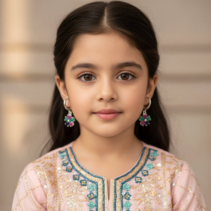 Silver earrings with colorful stones on a gray background, featuring the brand 'SAHELI'.