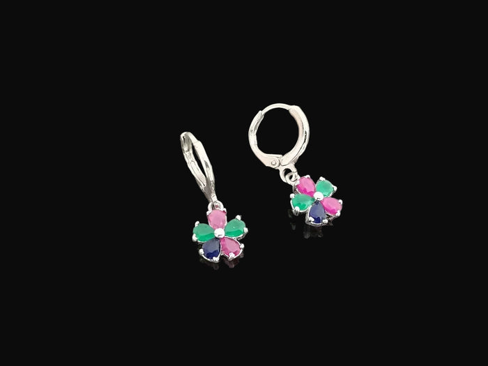 Silver earrings with colorful stones on a gray background, featuring the brand 'SAHELI'.