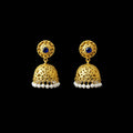 Gold earrings with blue stones and pearl accents on a gray stand, branded 'Saheili'.