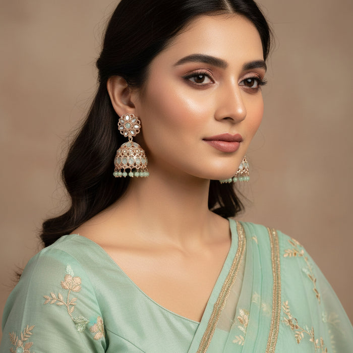 Pair of ornate earrings on a black background