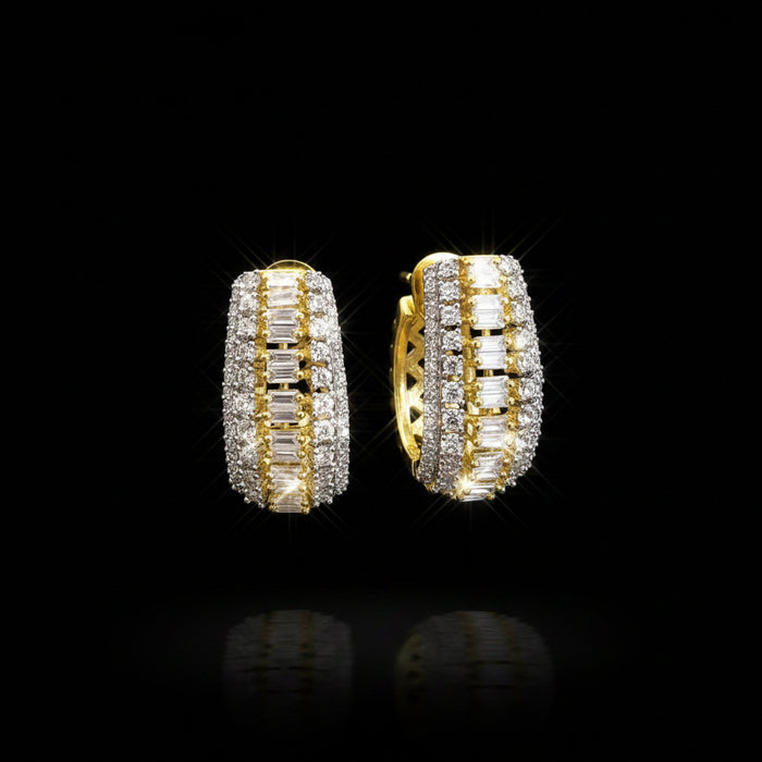 Gold and silver hoop earrings on a gray background with 'Saheili' branding.