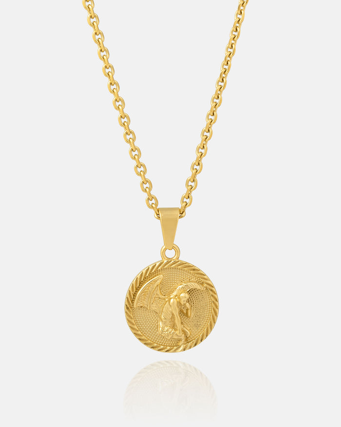 The Fallen Angel Medallion Pendant (Gold) is an 18k gold, waterproof, non-tarnish necklace with a round medallion featuring an embossed dragon design, shown against a plain white background.