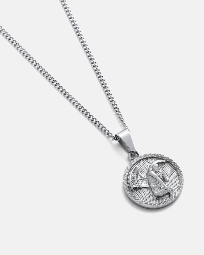 The Fallen Angel Medallion Pendant is a silver chain necklace with a round pendant featuring a raised fish and fishing rod design, set on a textured background with a classic rope-like border.