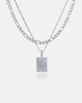 The Figaro Set (Custom Pendant Choice) features two layered silver chains: a flat curb chain and a thinner Figaro chain with a rectangular pendant displaying a raised butterfly design, shown on a plain white background.