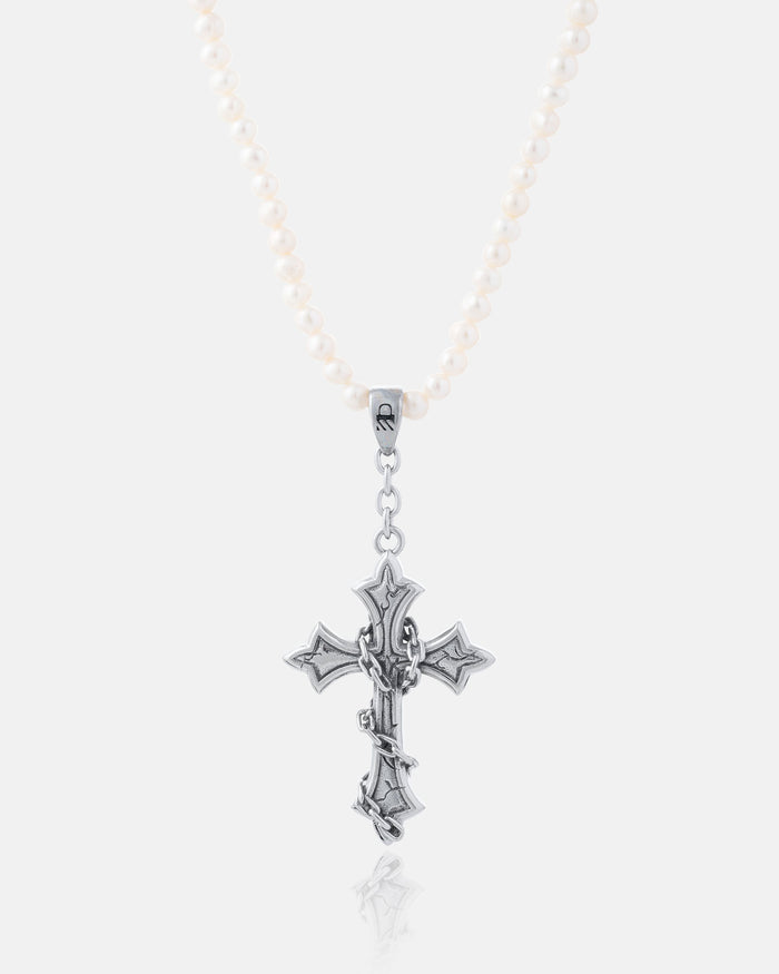 The Freshwater Pearl Necklace With Custom Pendant Choice showcases white waterproof pearls and a large, ornate silver cross with gothic details, set against a plain light gray background.