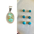 Wildflower Artisans Santa Fe jewelry set featuring a Kingman Red Web turquoise pendant and turquoise stud earrings.