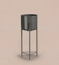 Large black pot on stand