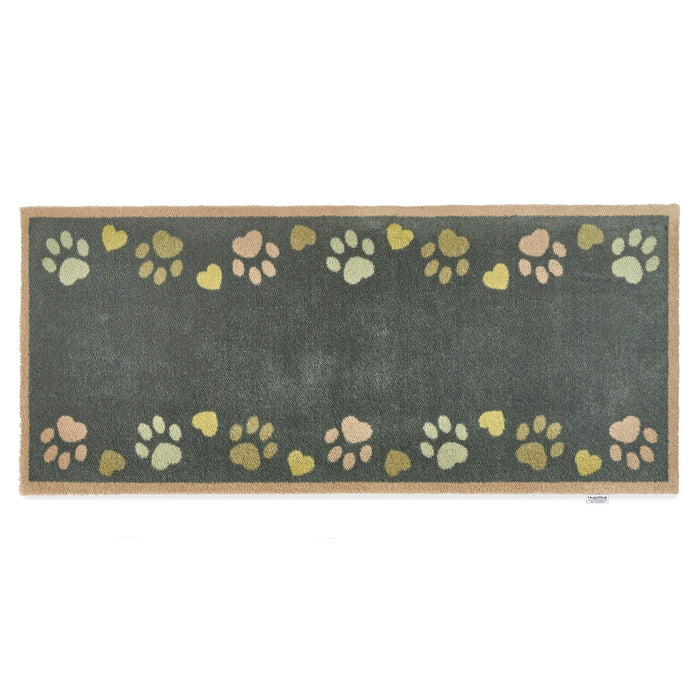Love Paws Green Washable Runner in Green- a 100% recycled cotton runner featuring paw prints in shades of blue and green along the long sides of the runner.