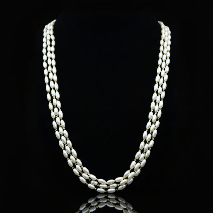 Pearl necklace on a black background