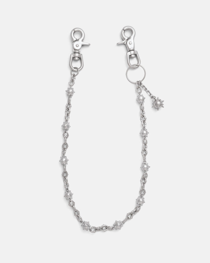Silver spiked chain link wallet chain with spiked mase balls throughout, including an extra dangling spiked mase ball charm. Silver heavy duty hardware clips to hook onto you belt loops. on grey background.