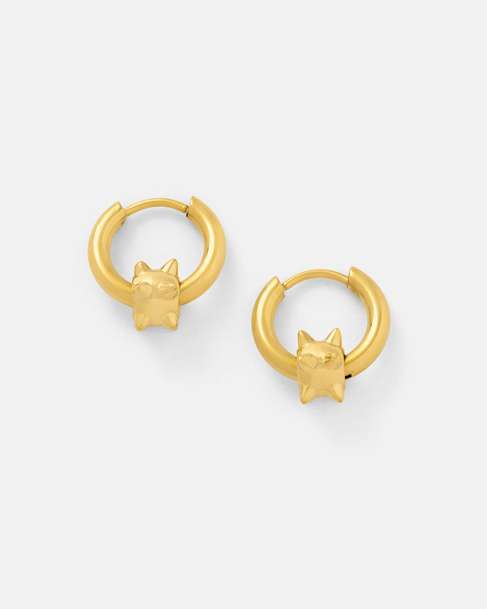 The "Morning Star" Earrings (Gold) are 18k gold-plated hoops, each adorned with a small sculpted cat head at the bottom, shown against a plain white background.