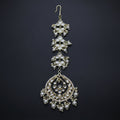 Ornate necklace with pearls on a dark background